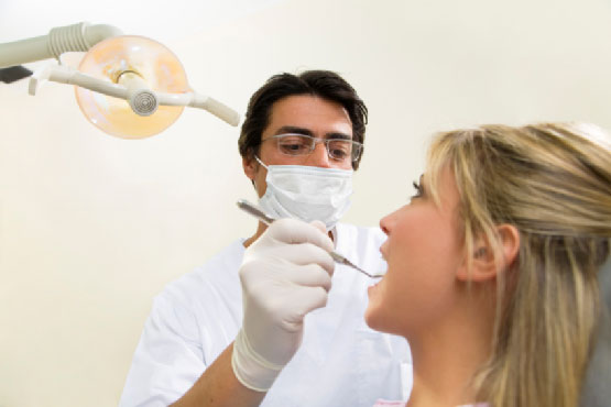 a dentist treating patient