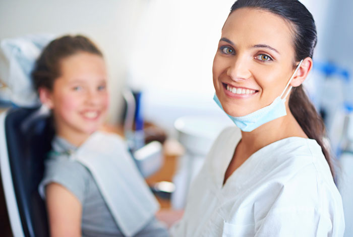 A dentist and a doctor smiling