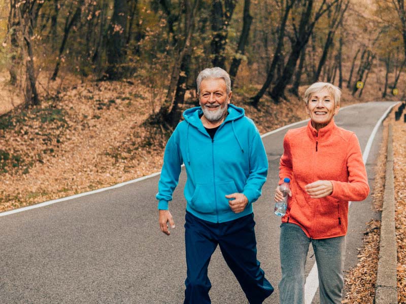 couple is running on road