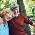 laughing senior couple on picnic