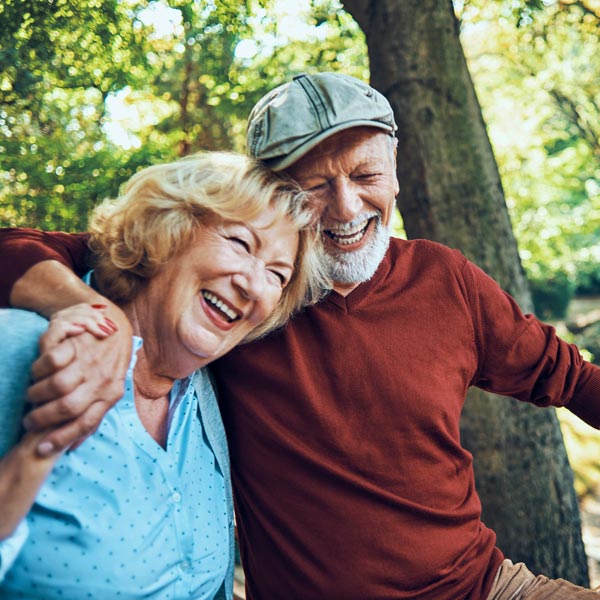 laughing senior couple on picnic