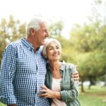 smiling senior couple on walk