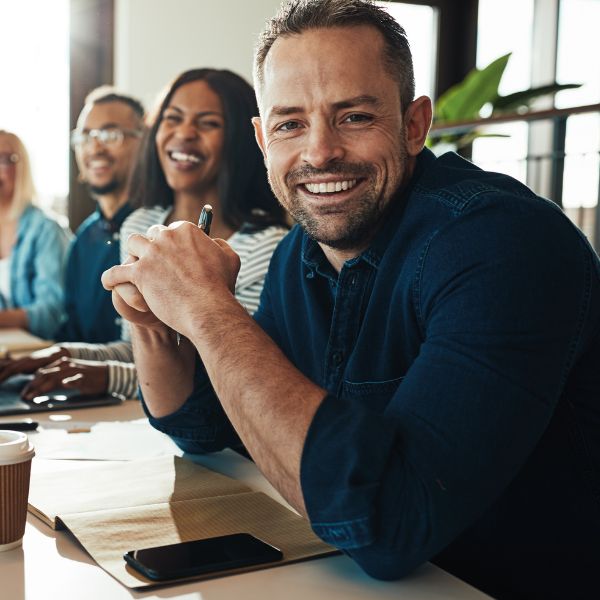 businessman smiling with colleagues
