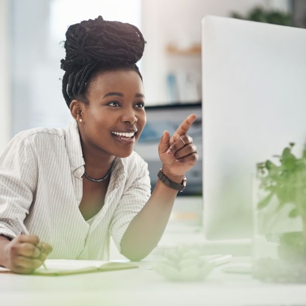 business woman smiling at computer
